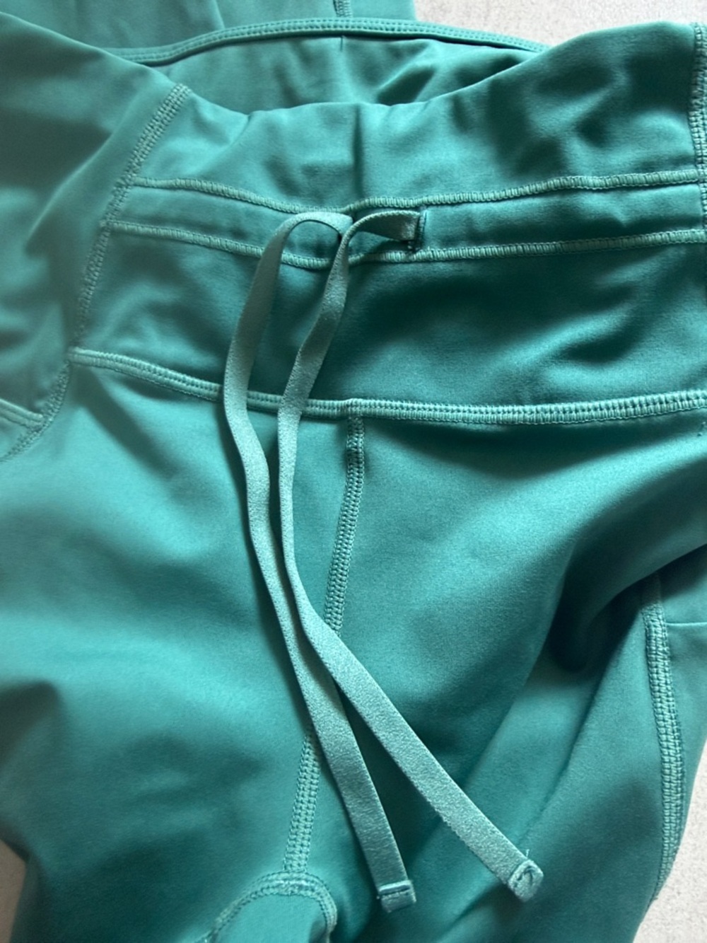Fabletics Teal Drawstring Performance Leggings with Side Pockets - Picture 3 of 3